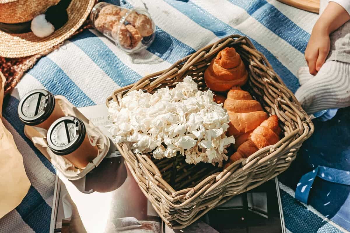Snacks on a picnic blanket.