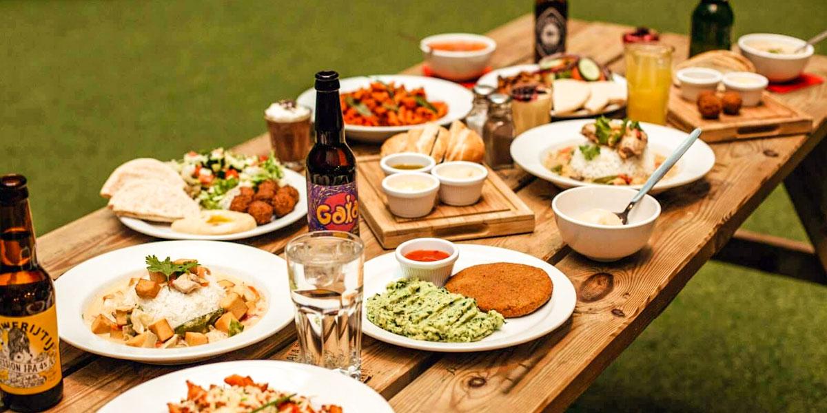 a mix of food and drinks from Zinc Bar at ClinkNOORD hostel in Amsterdam