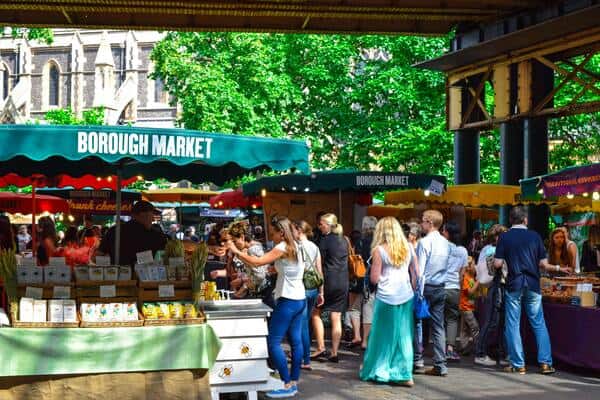 people walking past stalls in Borough Market