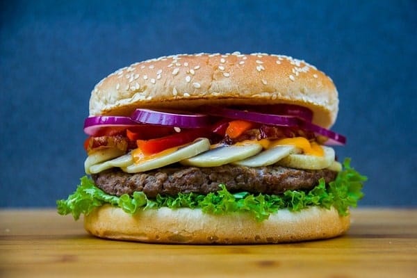 Burger with onions and gherkins