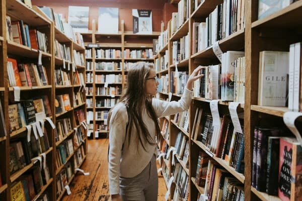 Lady browsing for books in a bookshop