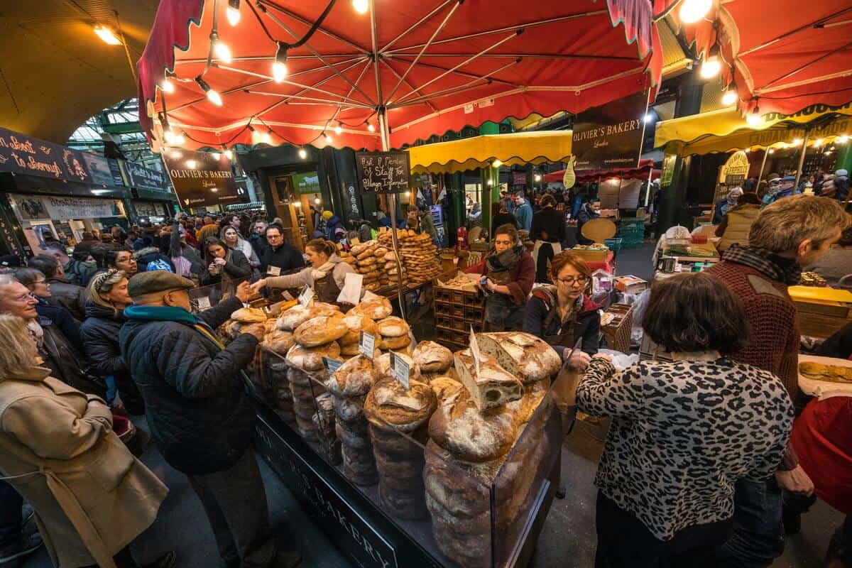 People at a food stall in Borough Market, London