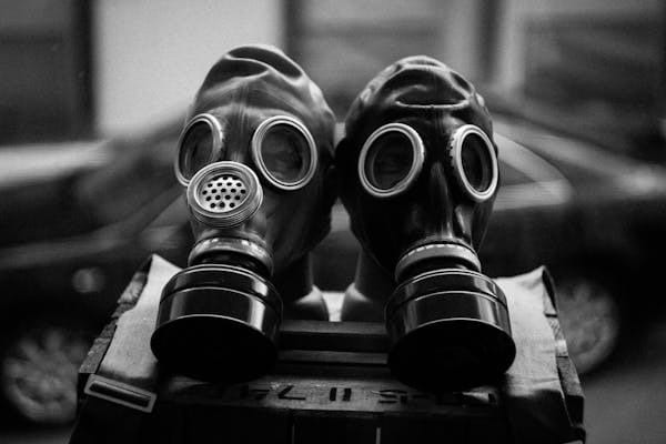 2 gas masks in black and white