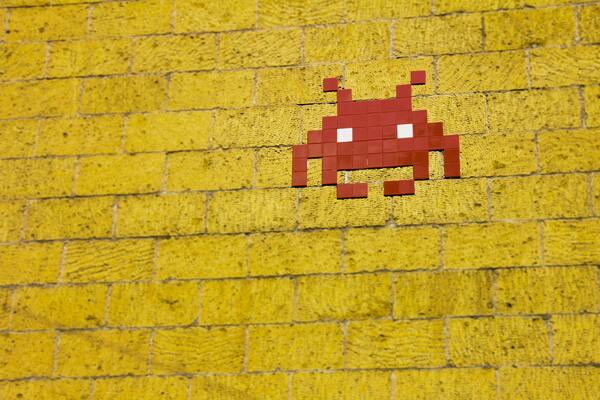 Art on a wall, similar to the mosaic space invaders