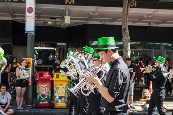 People playing instruments, parading the streets for St. Patrick's Day