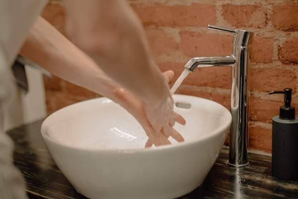 someone washing their hands