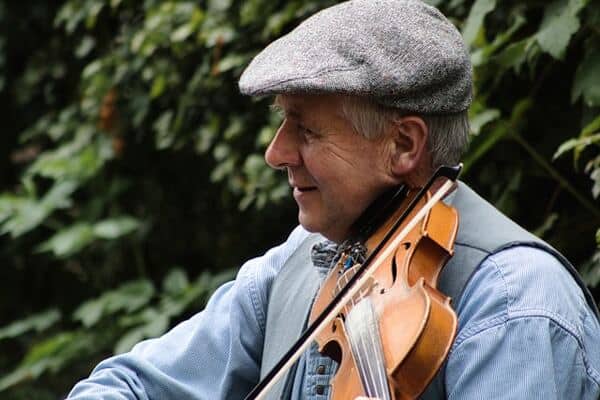 Old Irish man playing the violin