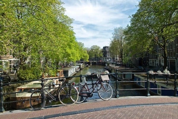2 bikes on a bridge in Amsterdam