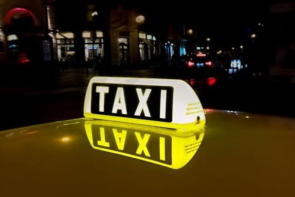 Taxi sign at night