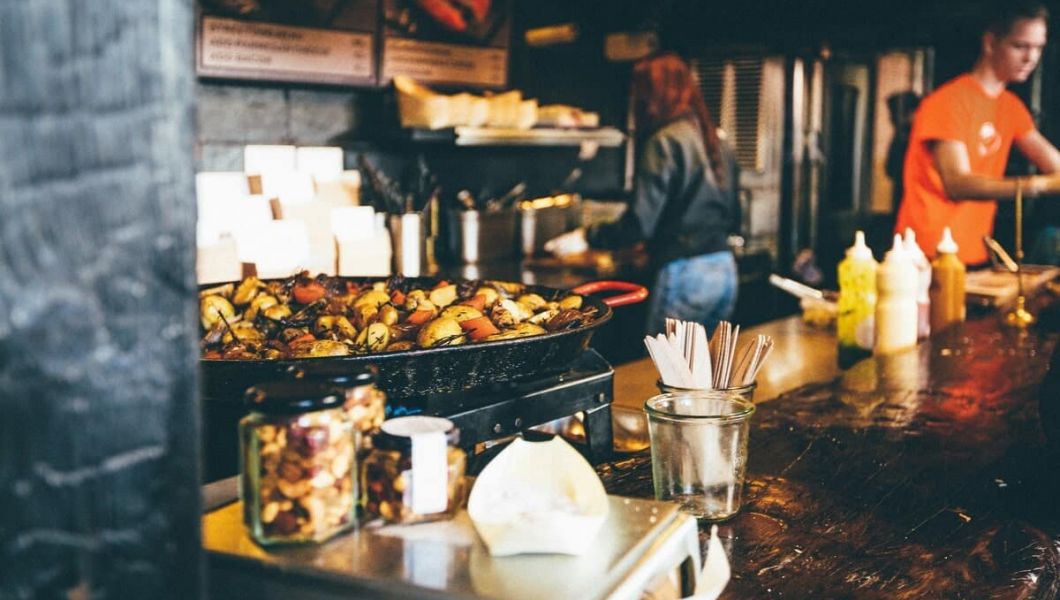 People cooking in a food stall