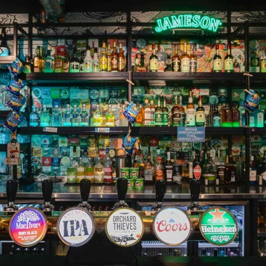 beers, wine and spirits at the bar at clink i lar hostel in dublin city