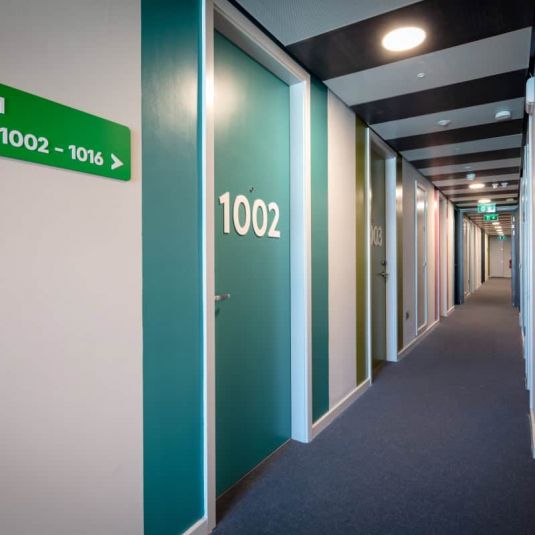 Clink i Lar hostel corridor and room signs